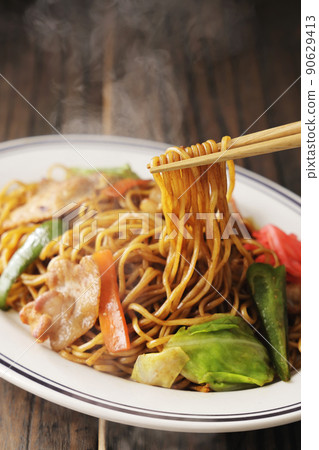 Yakisoba with a sizzle-like sauce lifted with chopsticks Yakisoba with a sizzle-like sauce lifted with chopsticks 90629413