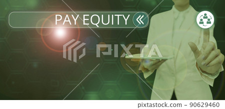 Hand writing sign Pay Equity. Business concept eliminating sex and race discrimination in wage systems Lady in suit holding pen symbolizing successful teamwork accomplishments. 90629460