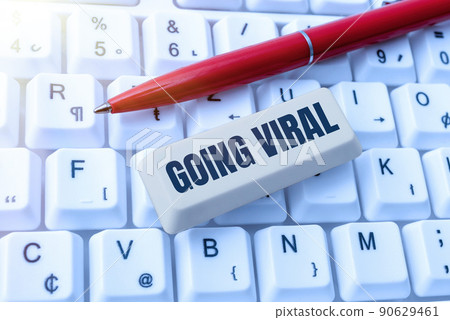 Text showing inspiration Going Viral. Business approach image video or link that spreads rapidly through population Businessman in suit holding tablet symbolizing successful teamwork. 90629461