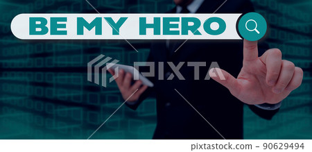 Conceptual caption Be My Hero. Word Written on Request by someone to get some efforts of heroic actions for him Businessman in suit holding notepad symbolizing successful teamwork. Conceptual caption Be My Hero. Word Written on Request by someone to get some efforts of heroic actions for him Businessman in suit holding notepad symbolizing successful teamwork. 90629494
