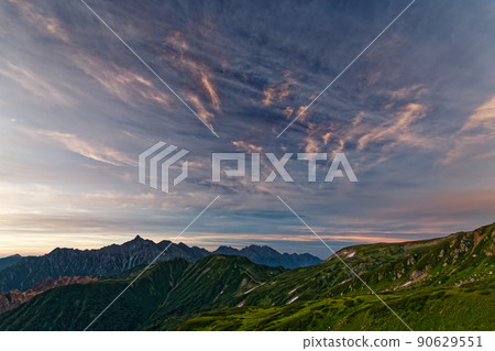 Mt. Yarigatake, Mt. Hotaka and sunrise clouds seen from the ridgeline of Mt. Mitsumata Mt. Yarigatake, Mt. Hotaka and sunrise clouds seen from the ridgeline of Mt. Mitsumata 90629551
