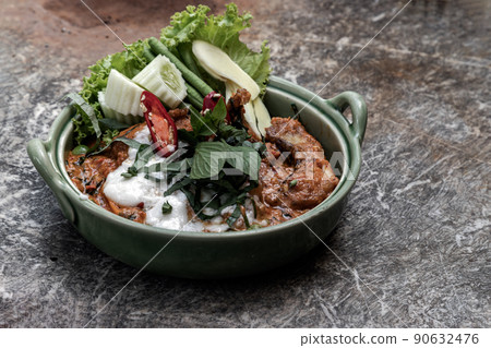Traditional stir fried spicy Asian Redtail Catfish (Hemibagrus wyckioides) or Kang catfish with red curry paste. Traditional stir fried spicy Asian Redtail Catfish (Hemibagrus wyckioides) or Kang catfish with red curry paste. 90632476