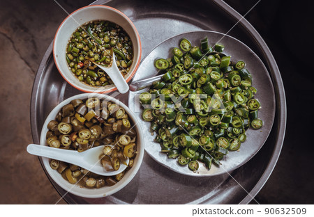 Sliced fresh green chili spur pepper, Pickled chillies in vinegar and Chillis fish sauce.. Sliced fresh green chili spur pepper, Pickled chillies in vinegar and Chillis fish sauce.. 90632509