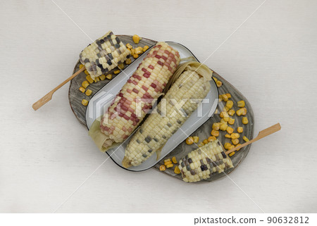 Fresh waxy corn or Sweet glutinous corn and Corn kernels on White background. 90632812