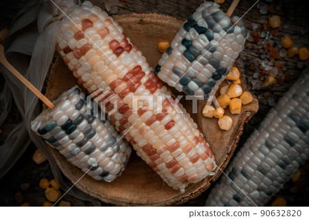 Close-up of Fresh waxy corn or Sweet glutinous corn and Corn kernelson Rustic old wooden background. Close-up of Fresh waxy corn or Sweet glutinous corn and Corn kernelson Rustic old wooden background. 90632820