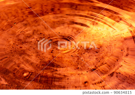 Circles on orange brown fluid Circles on orange brown fluid 90634815