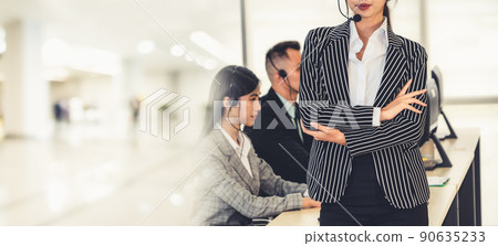 Business people wearing headset working in office broaden view Business people wearing headset working in office broaden view 90635233