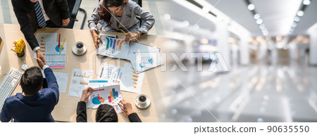 Group business people handshake at meeting table in widen view Group business people handshake at meeting table in widen view 90635550