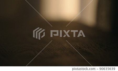 black wood table with sunset light on background 90635639