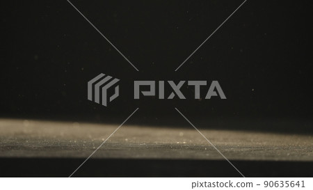 dust fall on wood table backlit by sun dust fall on wood table backlit by sun 90635641