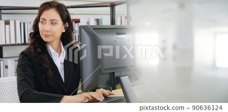 Business people wearing headset working in office broaden view Business people wearing headset working in office broaden view 90636124