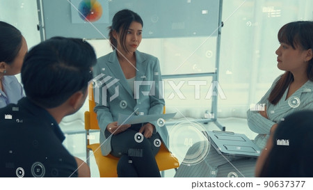 Business people in corporate staff meeting with envisional graphic Business people in corporate staff meeting with envisional graphic 90637377