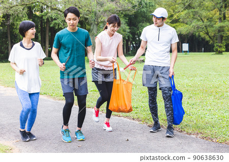 A young man picking up trash A young man picking up trash 90638630