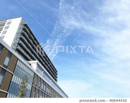 Blue sky and background material for newly built condominiums Blue sky and background material for newly built condominiums 90644430