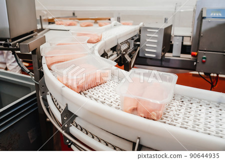 A modern plant.Factory production food from meat. Production line with packaging and cutting of meat.Conveyor Belt Food.Automated production line in modern food factory. A modern plant.Factory production food from meat. Production line with packaging and cutting of meat.Conveyor Belt Food.Automated production line in modern food factory. 90644935