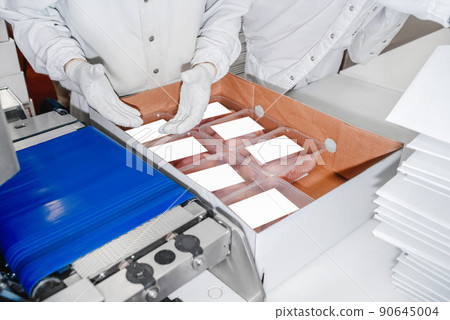 Production process, packaging on the conveyor line of meat in boxes.Conveyor Belt Food.Automated production line in modern food factory.People working.Chicken fillet production line. Production process, packaging on the conveyor line of meat in boxes.Conveyor Belt Food.Automated production line in modern food factory.People working.Chicken fillet production line. 90645004