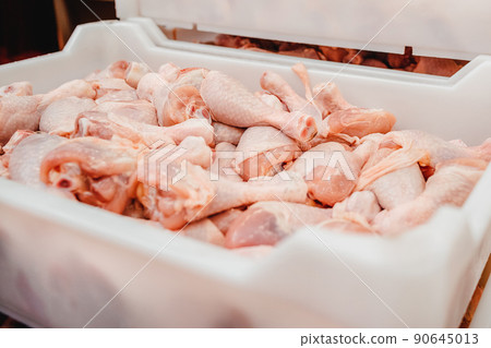 Conveyor Belt Food.The meat factory.Automated production line in modern food factory.Containers on a conveyor line with raw chicken drumstick.Factory for the production of food from meat,poultry. Conveyor Belt Food.The meat factory.Automated production line in modern food factory.Containers on a conveyor line with raw chicken drumstick.Factory for the production of food from meat,poultry. 90645013