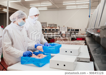 Chicken fillet production line . Factory for the production of food from meat.Modern poultry processing plant.Conveyor Belt Food.The meat factory. Chicken fillet production line . Factory for the production of food from meat.Modern poultry processing plant.Conveyor Belt Food.The meat factory. 90645128
