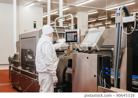 Automated production line with packaging and cutting of meat in modern food factory.Meat processing equipment. Automated production line with packaging and cutting of meat in modern food factory.Meat processing equipment. 90645316