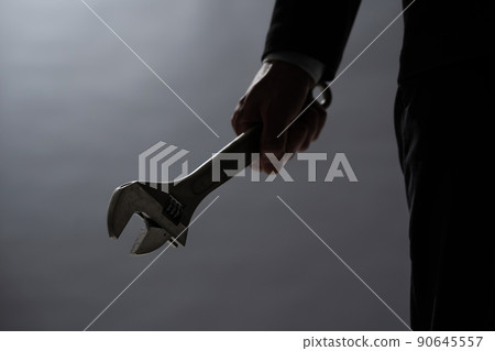 A man with a spanner A man with a spanner 90645557