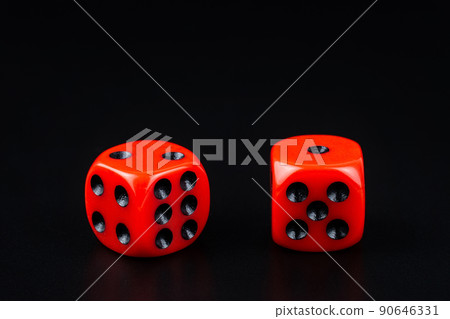 A pair of red dice on black background.close up view 90646331