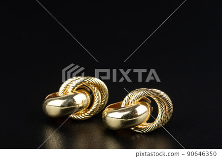 Jewelry earrings and costume jewelry on a black background Jewelry earrings and costume jewelry on a black background 90646350