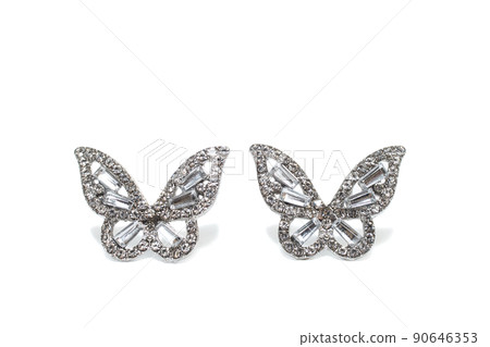 Earrings isolated on white background. Concept of fashion. 90646353