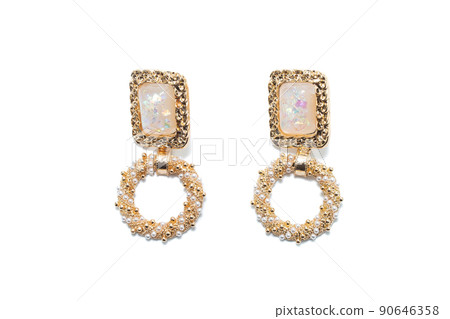 Earrings isolated on white background. Concept of fashion. Earrings isolated on white background. Concept of fashion. 90646358