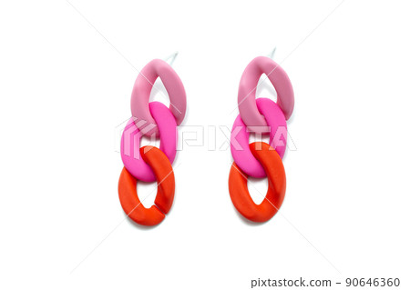 plastic earrings on a white insulated background plastic earrings on a white insulated background 90646360