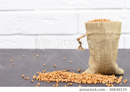 Buckwheat. Buckwheat on sacking. Raw buckwheat groats. Whole grain porridge. Buckwheat. Buckwheat on sacking. Raw buckwheat groats. Whole grain porridge. 90646534