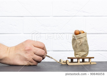 Grocery basket with hazelnuts on a gray background 90646858