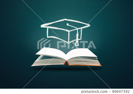 Eduction and gradfuation concept. Open books with hand drawn with graduation hat. Studying Eduction and gradfuation concept. Open books with hand drawn with graduation hat. Studying 90647392