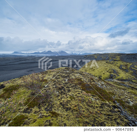 Iceland autumn tundra landscape near Haoldukvisl glacier, Iceland. Glacier tongue slides from the Vatnajokull icecap or Vatna Glacier near subglacial Esjufjoll volcano. Not far from Iceland Ring Road. 90647893