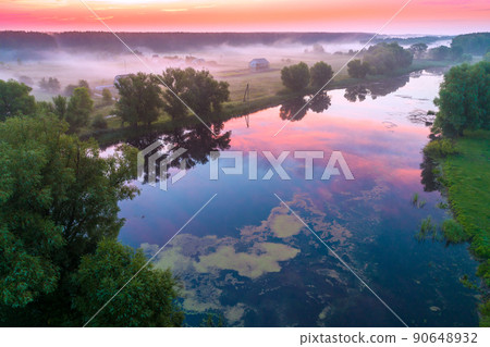 Early misty morning, sunrise over the lake. Rural landscape in summer. Aerial view Early misty morning, sunrise over the lake. Rural landscape in summer. Aerial view 90648932