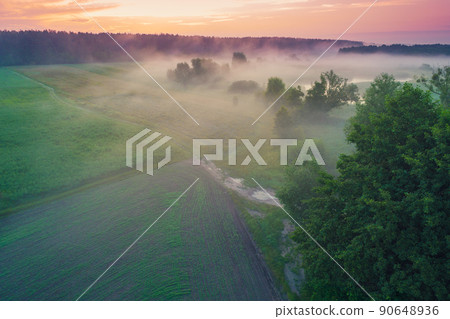 Early misty morning, sunrise over the lake. Rural landscape in summer. Aerial view Early misty morning, sunrise over the lake. Rural landscape in summer. Aerial view 90648936