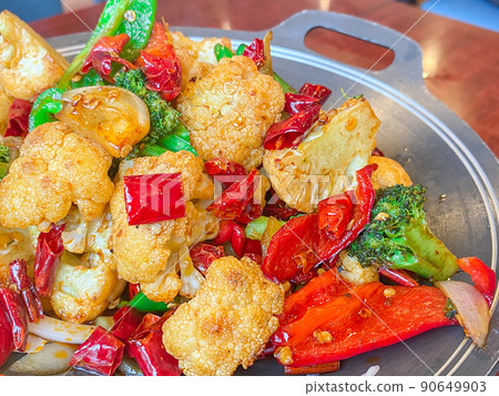 Chinese Silk Road dish, dried pot rape (cauliflower grilled in an iron pot) Chinese Silk Road dish, dried pot rape (cauliflower grilled in an iron pot) 90649903