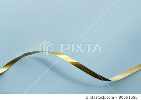 Ribbon on a paper background. Background for a greeting card. Ribbon on a paper background. Background for a greeting card. 90651686