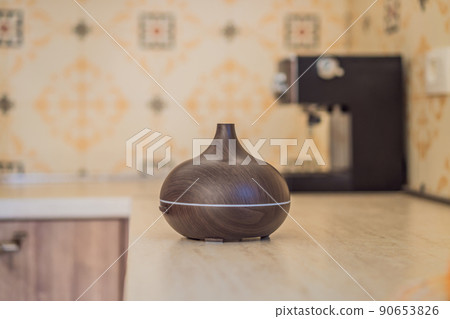 Aroma oil diffuser on table in kitchen Aroma oil diffuser on table in kitchen 90653826
