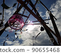 A wind chime that plays a cool tone on a hot summer day 90655468