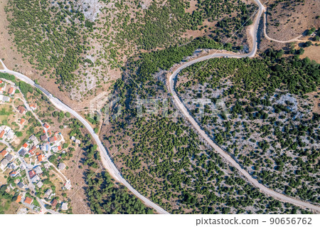 Meandering serpentine road in the mountain. Aerial view. Copter, drone view Meandering serpentine road in the mountain. Aerial view. Copter, drone view 90656762