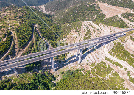 Aerial view on highway bridge in the mountain. Drone, copter view. 90656875