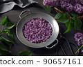 Lilac petals on plate 90657161