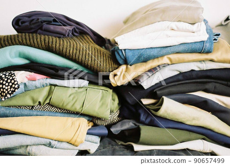 Miscellaneous clothes piled up 90657499