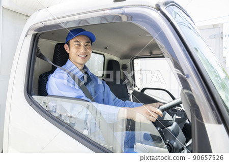 Truck driver looking at the camera smile Truck driver looking at the camera smile 90657526