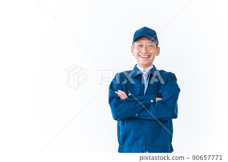A deliveryman with his arms folded and smiling A deliveryman with his arms folded and smiling 90657771