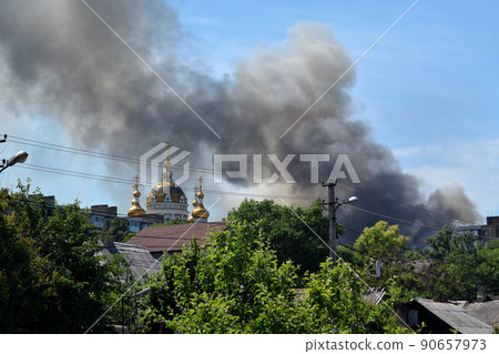 Embankment of the city of Donetsk. A construction crane on the shore. High-rise buildings Embankment of the city of Donetsk. A construction crane on the shore. High-rise buildings 90657973