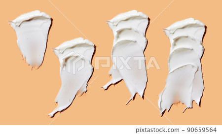 Set with different cosmetic smears on peach background. Beauty creme smear swatch. Cream, Lotion for face or body 90659564