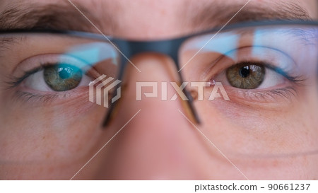Close up of man's face glasses. Boy opening his beautiful eyes. European young male model green eyes looking at camera. 90661237