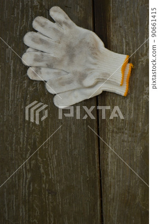 Dirty work gloves and old wood with a feeling of use Dirty work gloves and old wood with a feeling of use 90661415