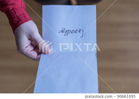 woman with paper letter and word goodbye on a floor. Heart broken concept. Copy Space woman with paper letter and word goodbye on a floor. Heart broken concept. Copy Space 90661895